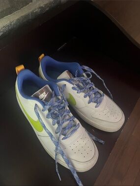 Nike White Sneakers with Lime Swoosh and Blue Accents